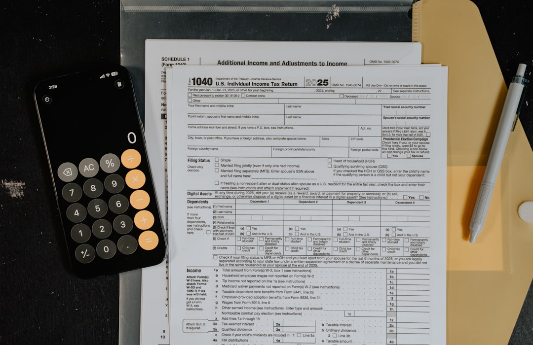 IRS audit risk concept with magnifying glass over tax forms
