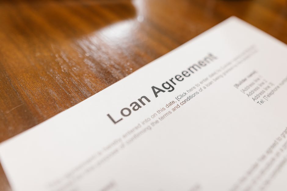 Small business owner using QuickBooks to explore loan options for 2024 business funding